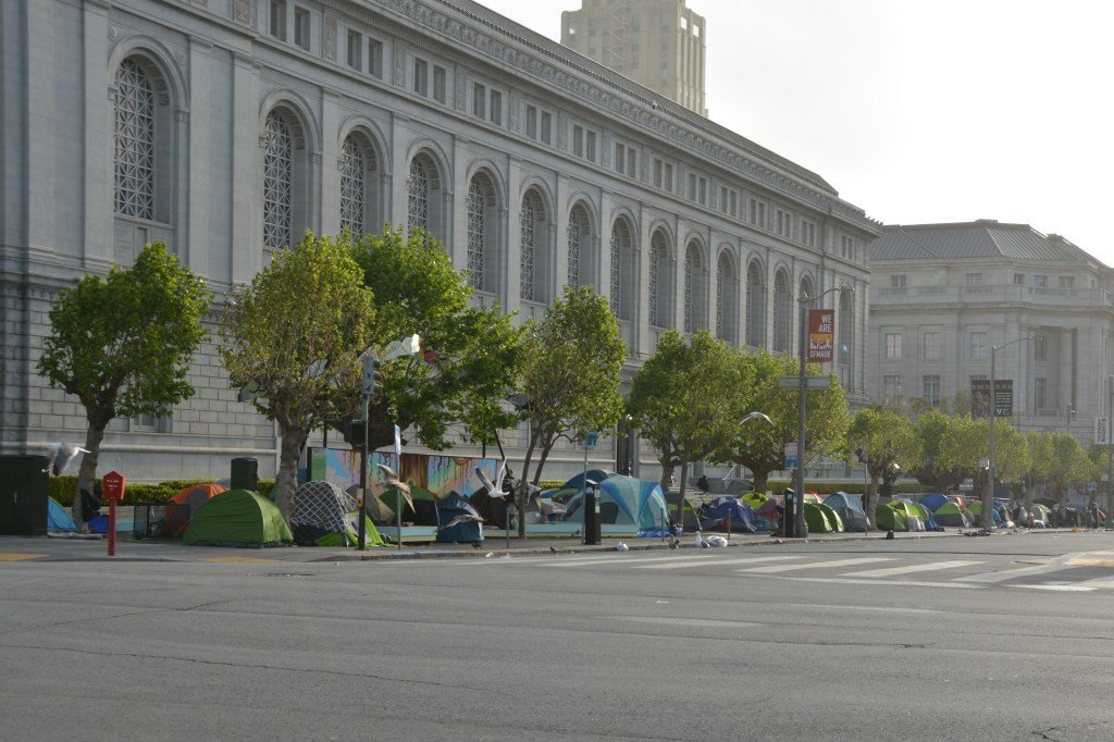 A close up of a street in front of a buildingDescription automatically generated