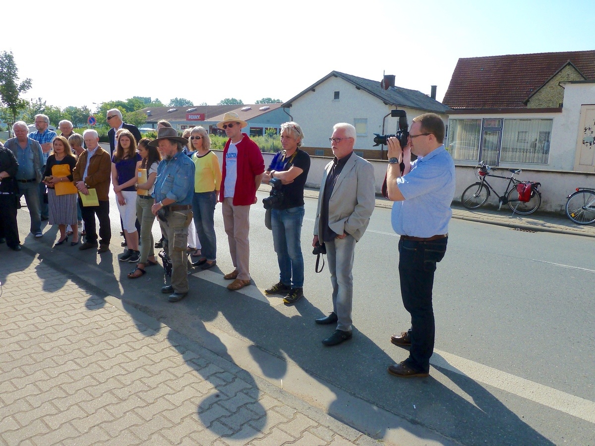 A group of people standing in front of a crowdDescription automatically generated