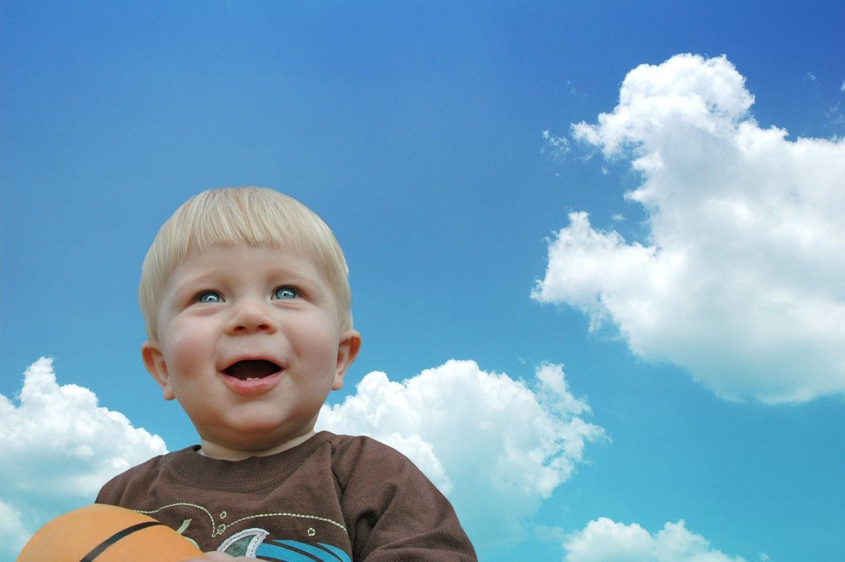 A picture containing sky, person, outdoor, childDescription automatically generated