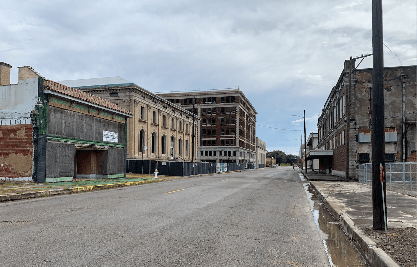 A street with buildings along it Description automatically generated with low confidence