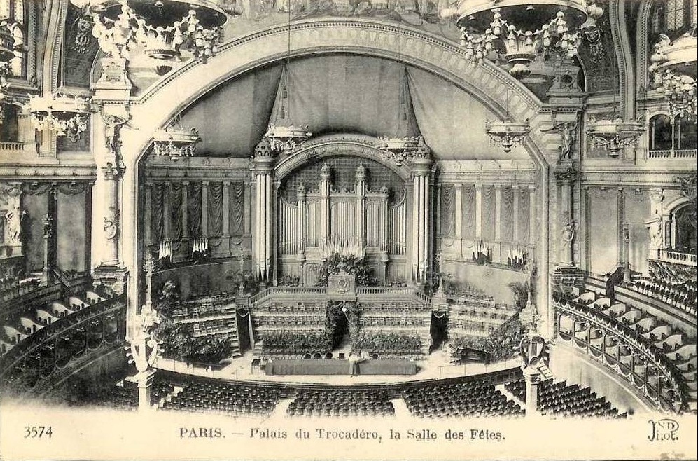 A picture containing text, old, building, whiteDescription automatically generated