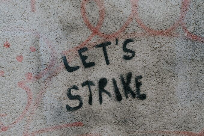 Image of graffiti reading "let's strike"