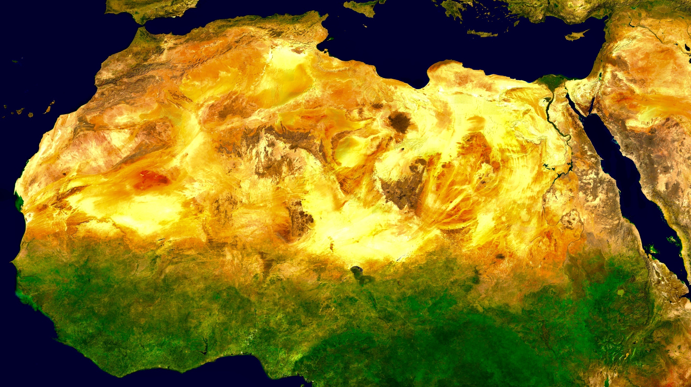 A satellite view of a yellow and green landDescription automatically generated