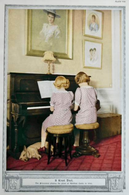 Two girls sitting at a piano Description automatically generated