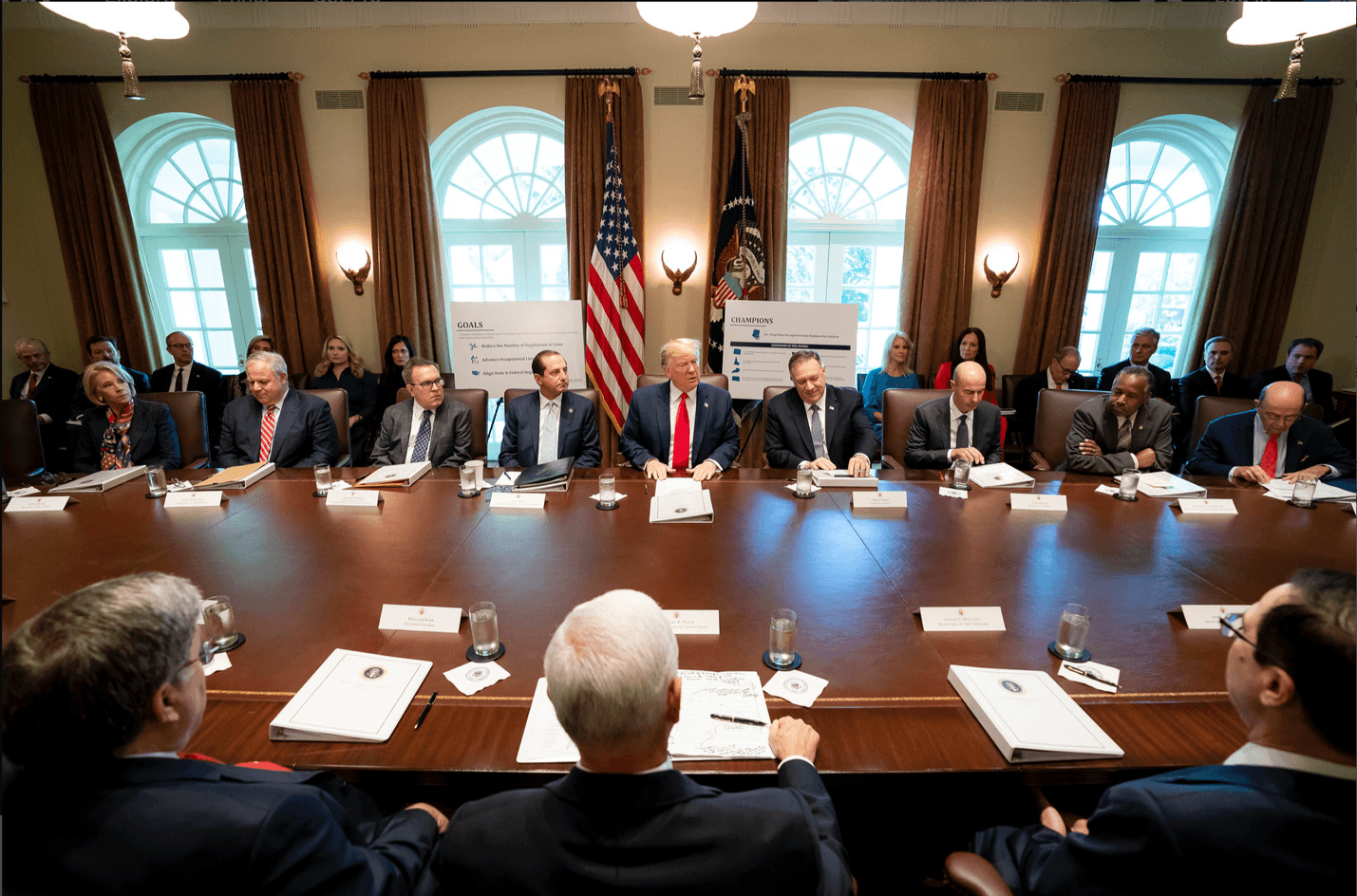 A group of people sitting at a tableDescription automatically generated