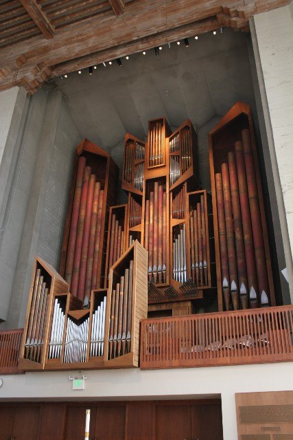 A large organ pipes in a building AI-generated content may be incorrect.