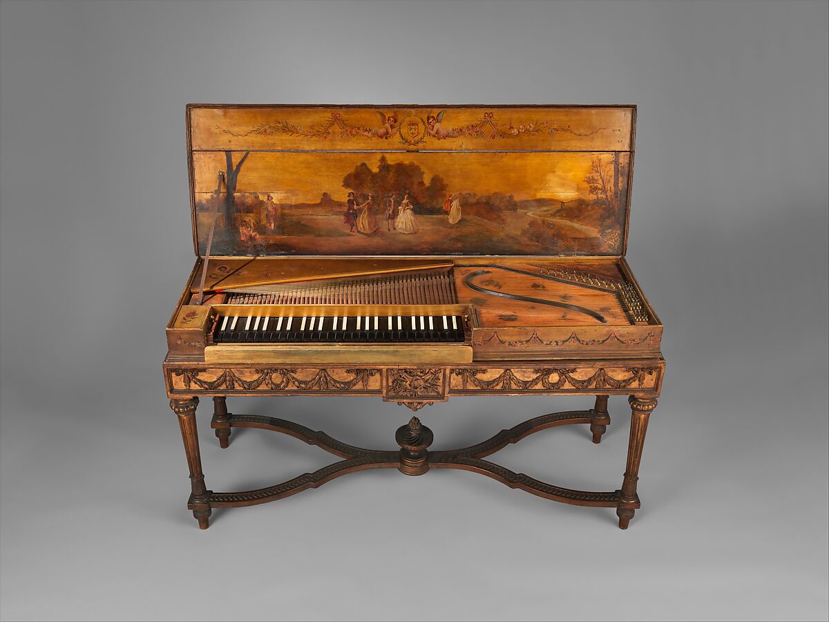 An antique piano with a painted coverAI-generated content may be incorrect.