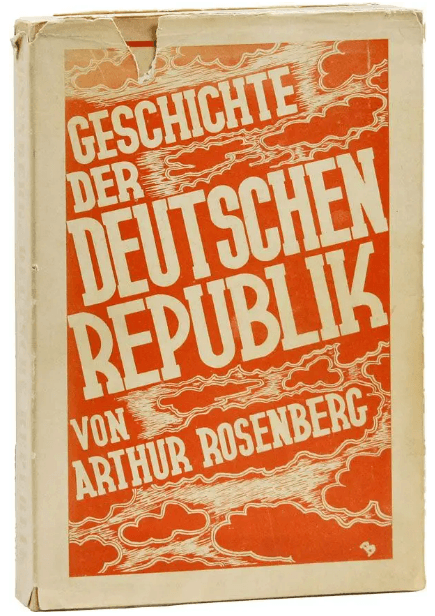 A book with a red and white cover Description automatically generated