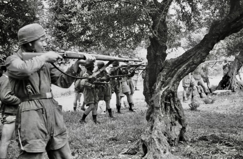 A group of soldiers holding guns AI-generated content may be incorrect.