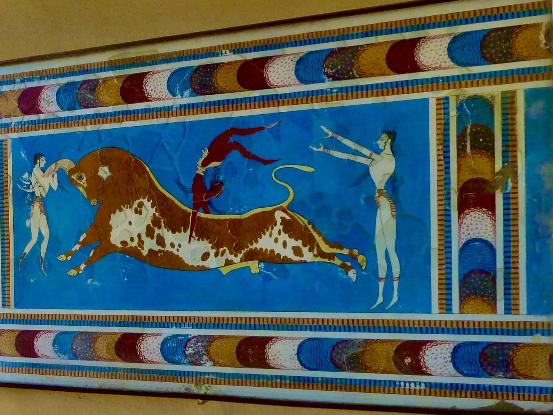 A painting of a bull and a person on a wall AI-generated content may be incorrect.