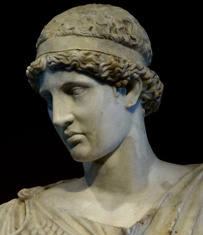 A statue of a person AI-generated content may be incorrect.