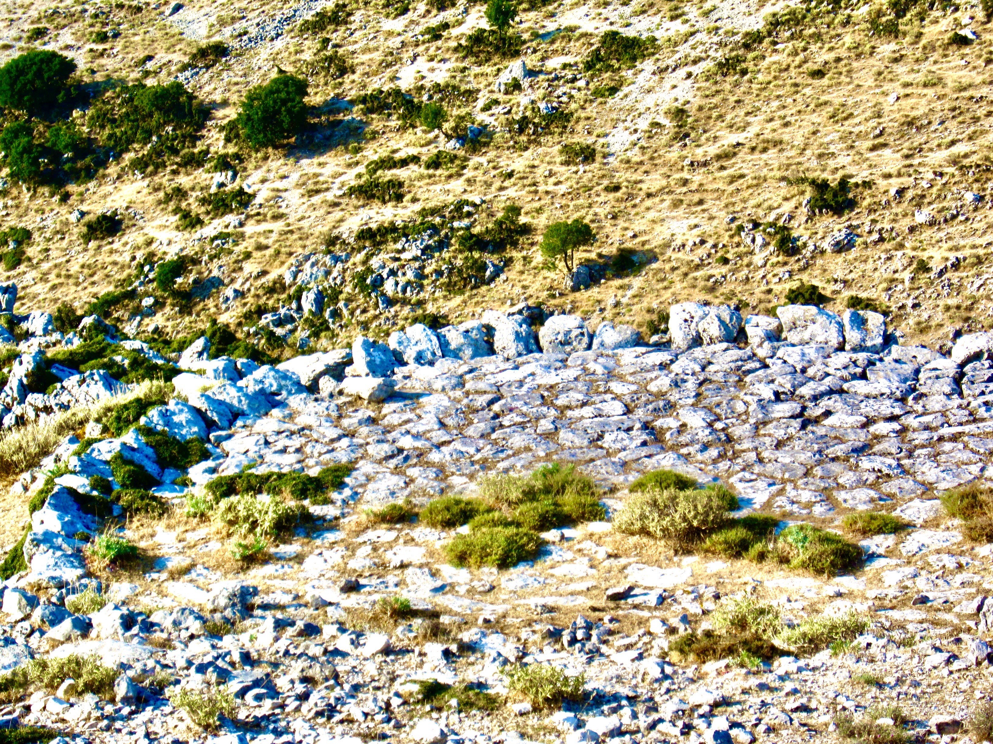 A stone wall in a desertAI-generated content may be incorrect.