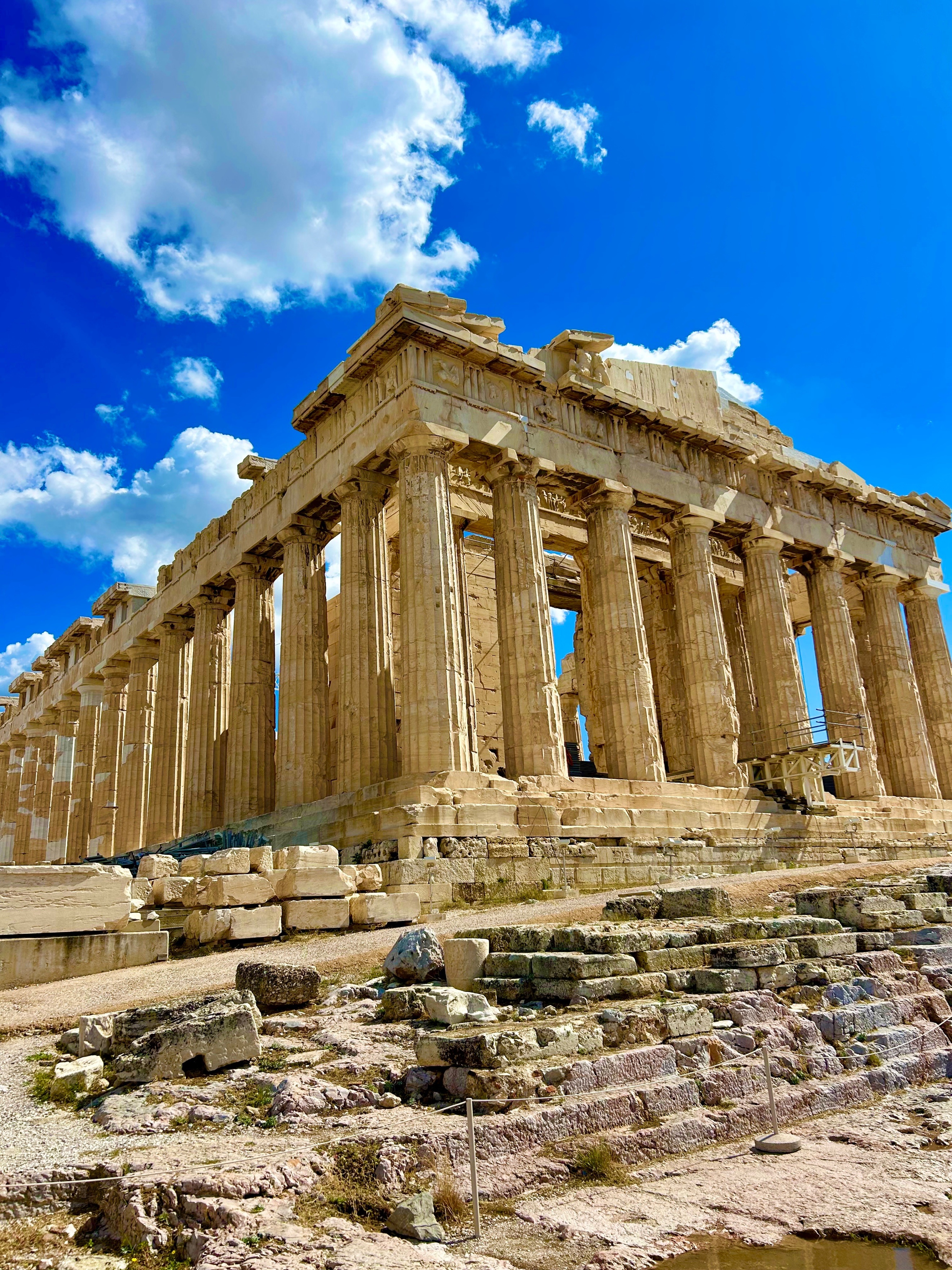 A stone building with columns AI-generated content may be incorrect.