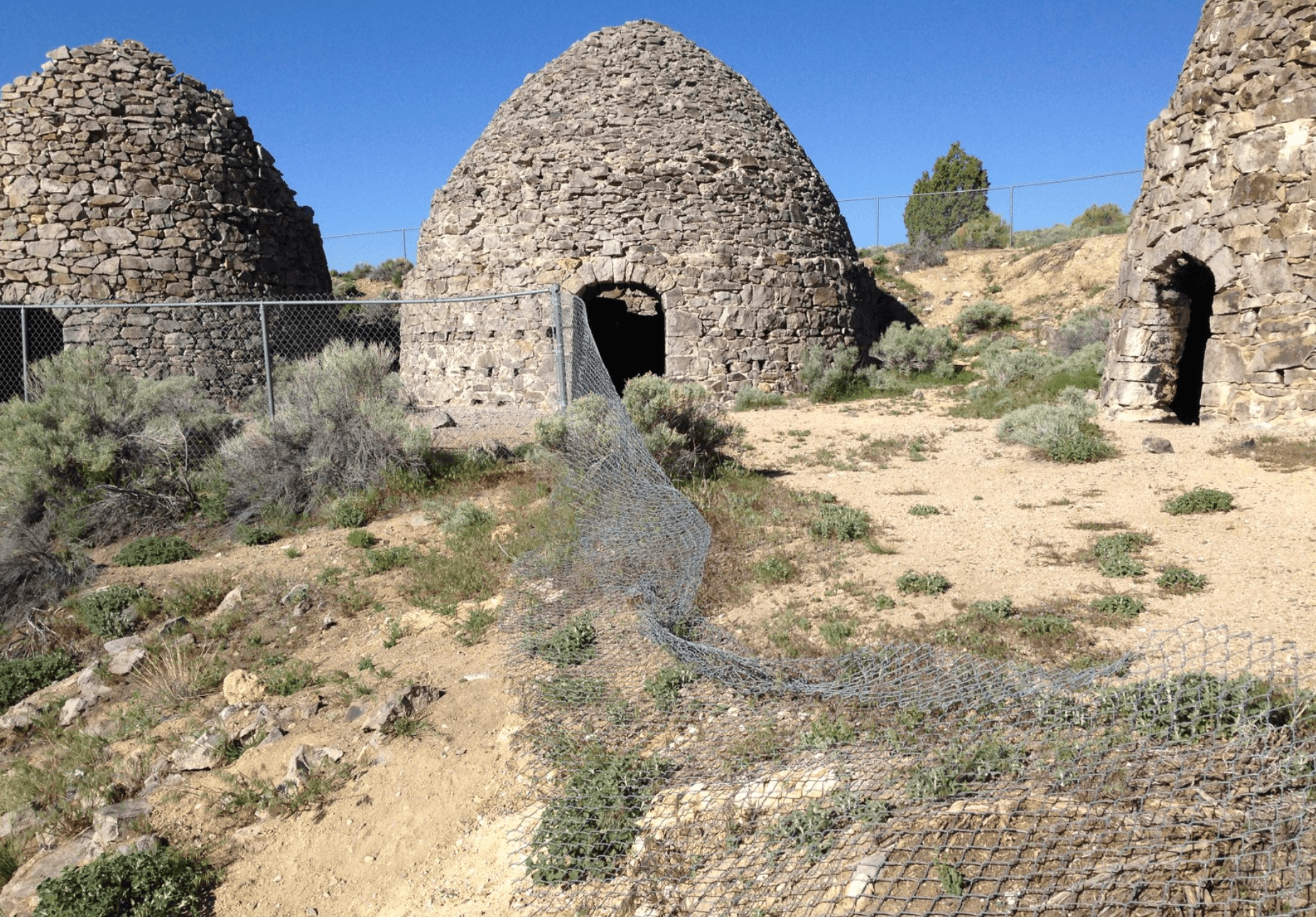 A stone structure with a gate
Description automatically generated with medium confidence