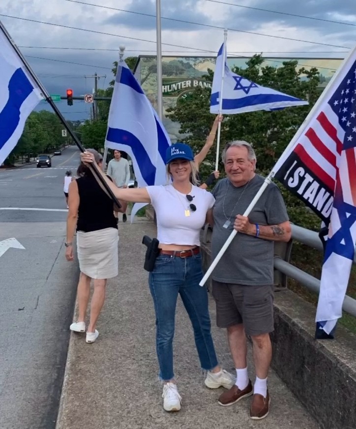 A group of people holding flags AI-generated content may be incorrect.